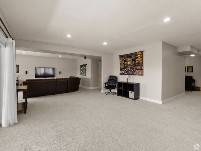 Carpeted family/game room with recessed lighting and brand new light colored carpet and walkout to backyard and views of the entire Heber Valley | Image 25