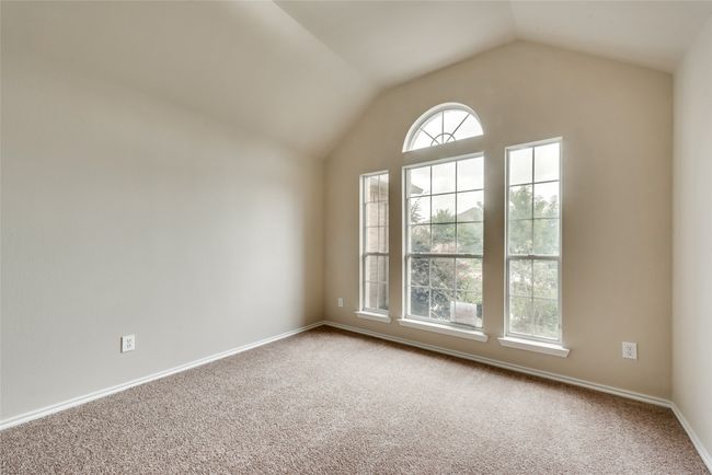 Unfurnished room featuring vaulted ceiling and carpet | Image 7