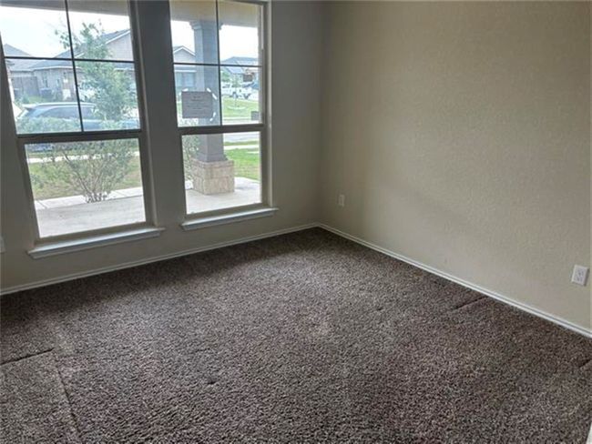 Unfurnished room with carpet floors and baseboards | Image 9