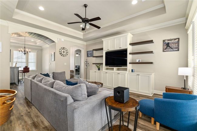 Another standout feature is the impressive built-in media unit, offering open shelving, closed cabinetry, and plenty of storage space! | Image 8