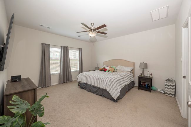 Bedroom featuring carpet and a ceiling fan | Image 35