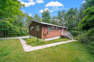 View of home's exterior with a yard | Image 2