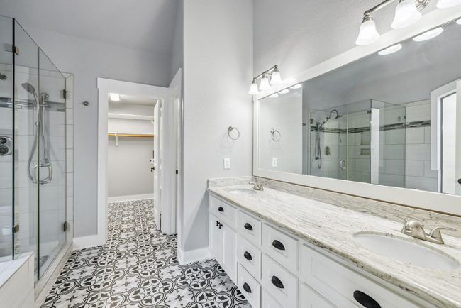 Upgraded master bathroom with walk in closet | Image 28