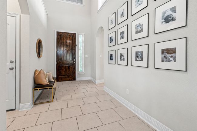 Showcasing the Open to Below ceilings right at the front of the home! | Image 4