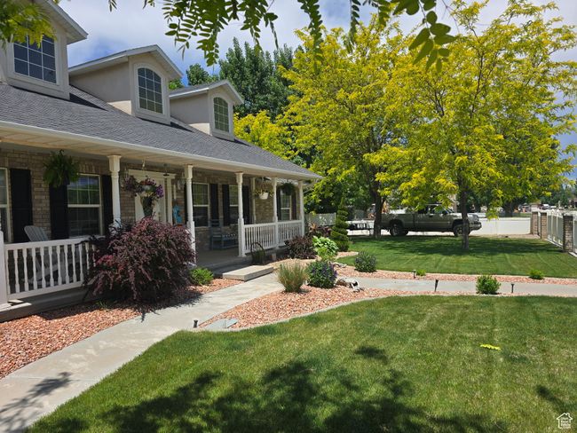 View of yard with covered porch | Image 78