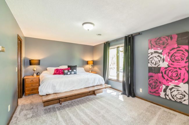 Large primary bedroom includes a private sitting area, large walk in closet and a 3/4 bathroom! This room also has brand new carpet. | Image 28