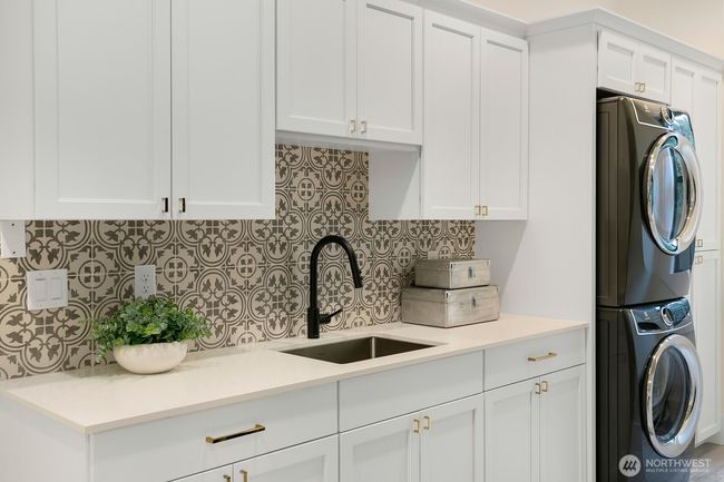 Main Floor Utility Sink + Stackable Washer/Dryer. | Image 23