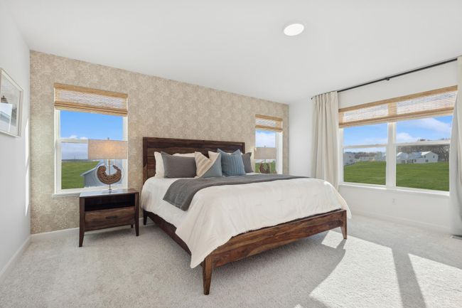 (Photo of a decorated model, actual homes finishes will vary) Find your retreat in this stunning primary suite. Enjoy the exclusivity of a private bath and a huge walk-in closet. | Image 10