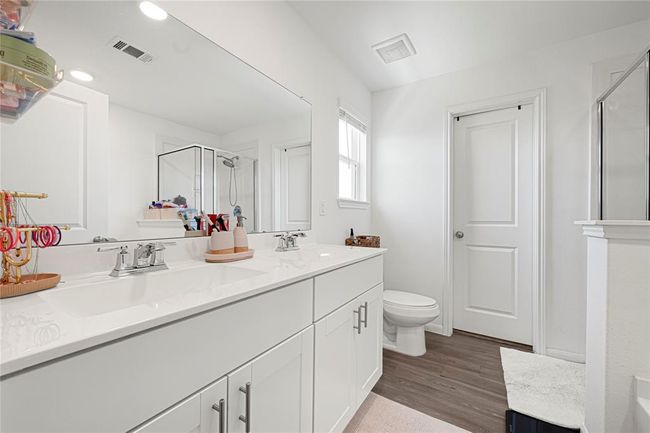 En-suite bath features soaking tub, walk-in shower, and dual vanities. | Image 20