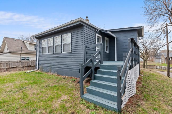 This home also boasts a spacious backyard with a 10x9 shed and a 14x8 deck, perfect for relaxing or entertaining outdoors. | Image 12