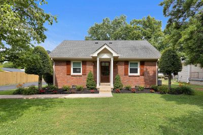 Charming cottage in Historic Franklin, Tn a few minutes from downtown. Well maintained and loved by current owner and it shows. Brick exterior with charming front entry and newer front door/hardward. | Image 1