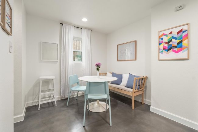Dining space featuring finished concrete floors and recessed lighting | Image 11