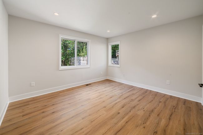 The secondary bedroom is perfect for a guest bedroom, home office, or den. | Image 25