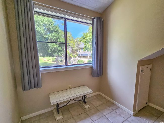 Empty room with baseboards and tile patterned floors | Image 32