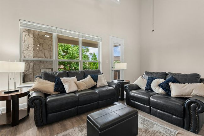 Beautiful two story living room with windows and light. Perfect for large gatherings. | Image 10