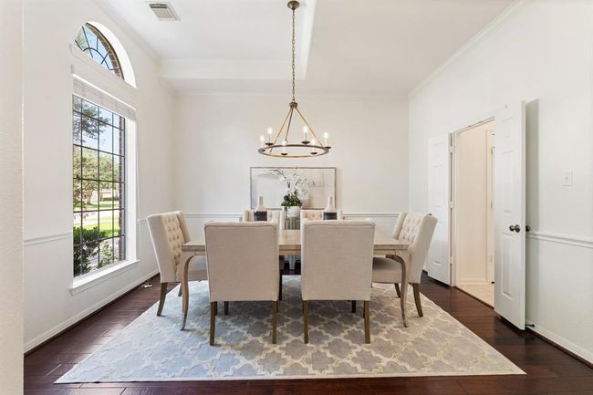 The formal dining room is located just off the kitchen at the front of the home. | Image 12