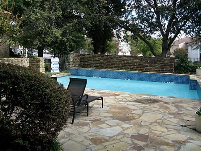 Community pool with a fenced backyard and a patio area | Image 25
