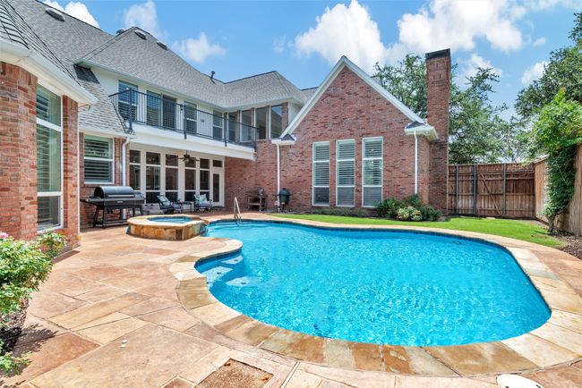 There is plenty of patio space around the pool for several seating areas. You can easily sunbathe, or relax under a shady umbrella with a good book. | Image 35