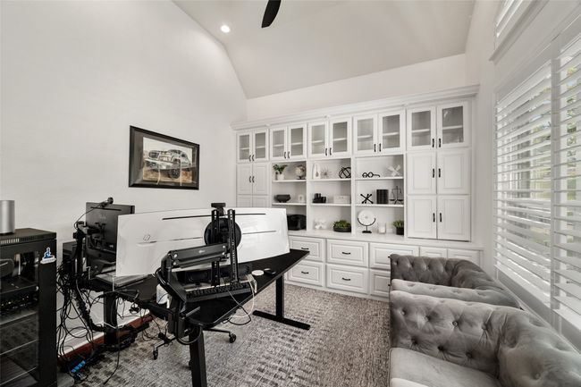 Office space with high vaulted ceiling, recessed lighting, and ceiling fan | Image 9