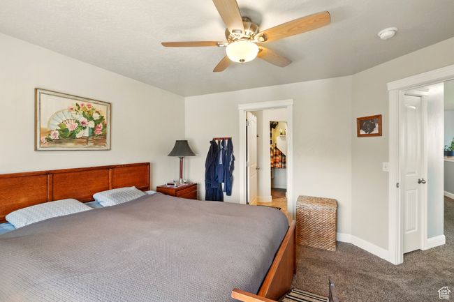 Bedroom with carpet, baseboards, and ceiling fan | Image 15