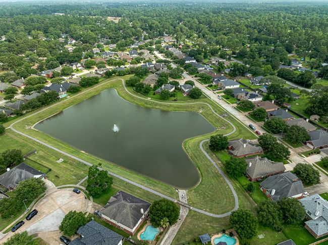 Aerial picture of the home on a premier lot in this serene neighborhood! Don't miss out on this incredible opportunity to own this exceptionally clean and well-maintained home! | Image 25