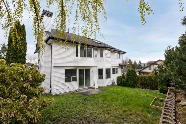 Back of property featuring a yard and a shingled roof | Image 38