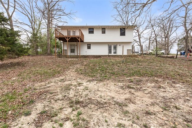 Rear view of house featuring french doors and a deck | Image 30