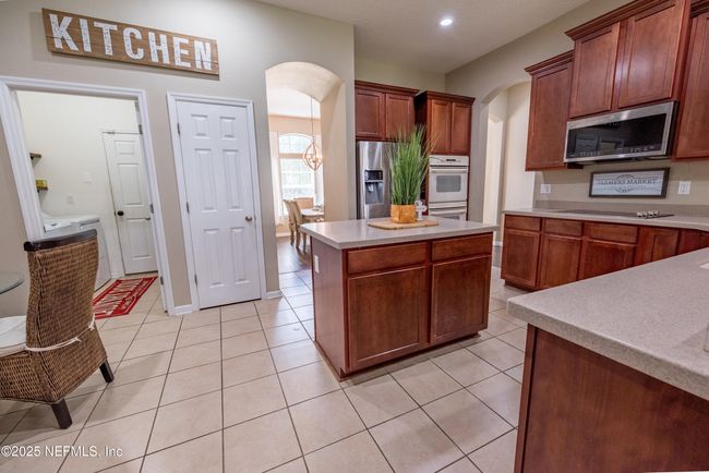 11760 Huckleberry Trl E, House other with 4 bedrooms, 2 bathrooms and null parking in MACCLENNY FL | Image 13
