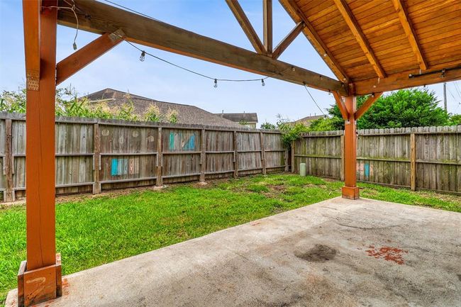 Despite the spacious covered patio, there’s still plenty of lush green space that is perfect for children to play or pets to roam freely. | Image 32