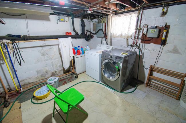 Washroom featuring laundry area and washing machine and dryer | Image 22