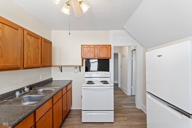Upper Kitchen with new LVP flooring- all appliances will stay | Image 41