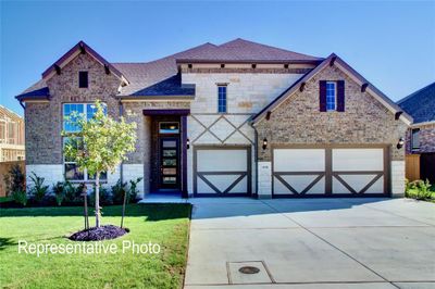 View of front of house featuring a garage | Image 1