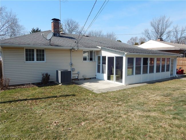 Rear view of property with central A/C unit, 2nd Patio, Yard and Sunroom. | Image 35