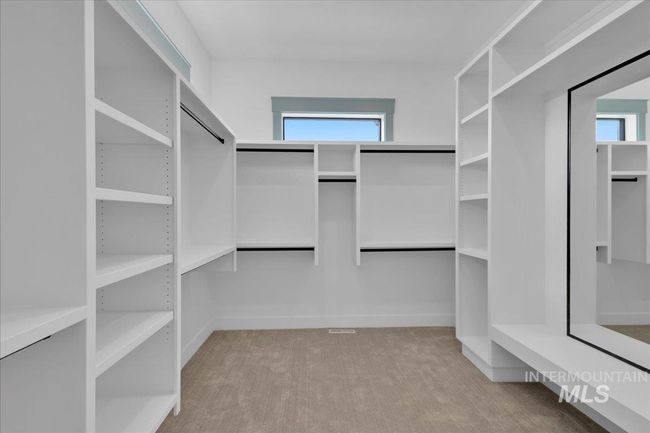 Walk in closet featuring carpet | Image 32