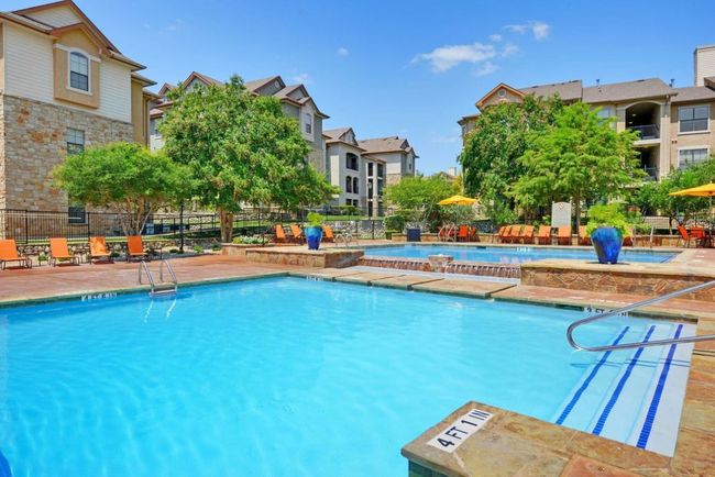 Community pool featuring a patio area and fence | Image 14