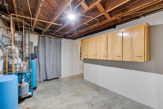 Clothes washing area with washer and clothes dryer and laundry area | Image 33