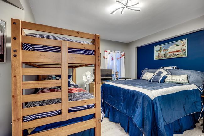 Bedroom featuring wood finished floors | Image 22