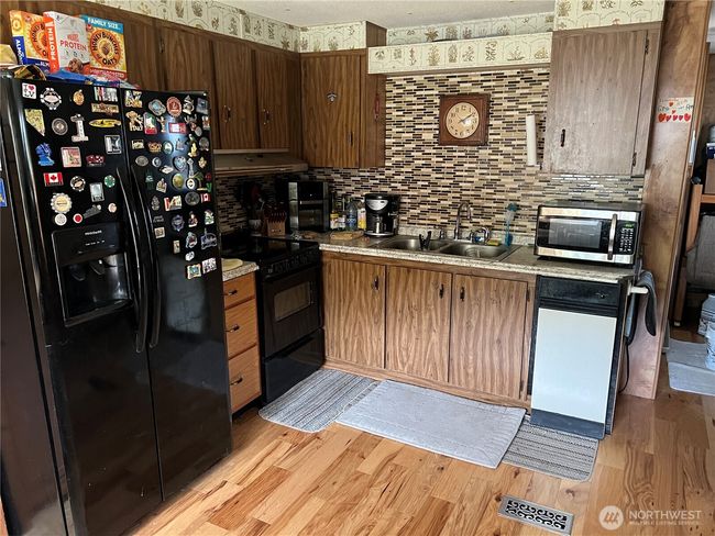 Kitchen with newer appliances. | Image 4