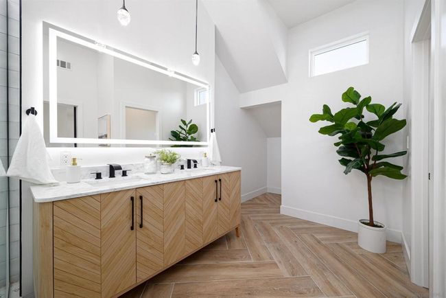 Primary bathroom with huge shower and claw tub combo with 70inch double vanity and LED mirror | Image 31