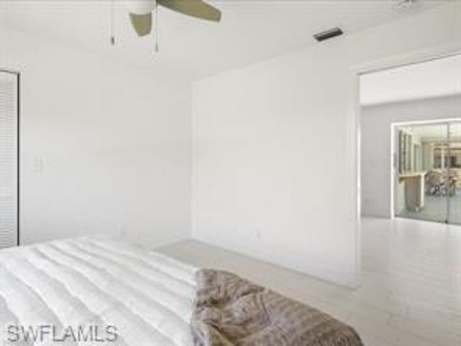 Bedroom with ceiling fan and hardwood / wood-style flooring | Image 20