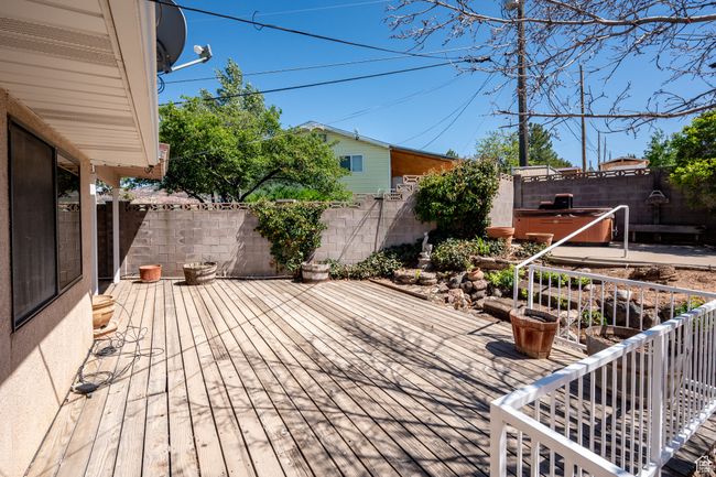 Deck featuring a fenced backyard | Image 44