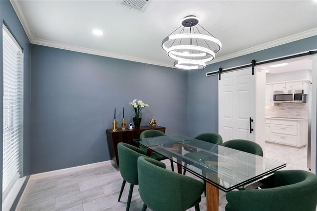 Dining Room opens into the kitchen. Note the Barn Door | Image 9