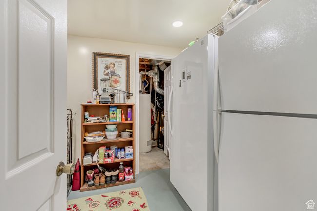 Hall featuring water heater, concrete floors, and recessed lighting | Image 43