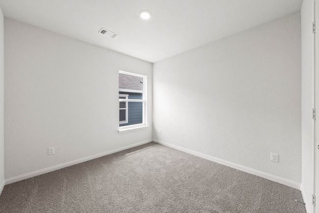 Carpeted empty room featuring baseboards | Image 9