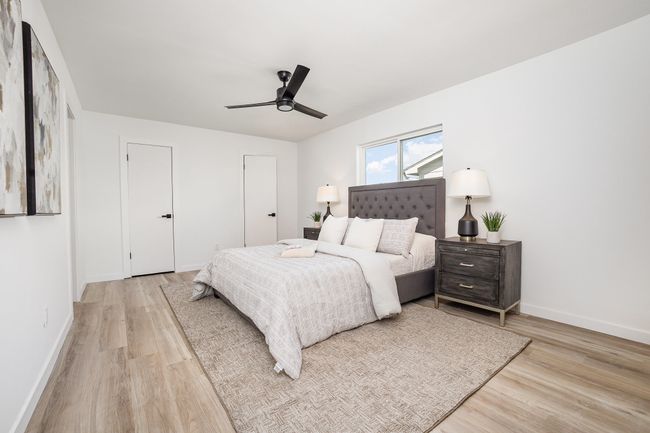 Bedroom featuring baseboards, ceiling fan, and wood finished floors | Image 22