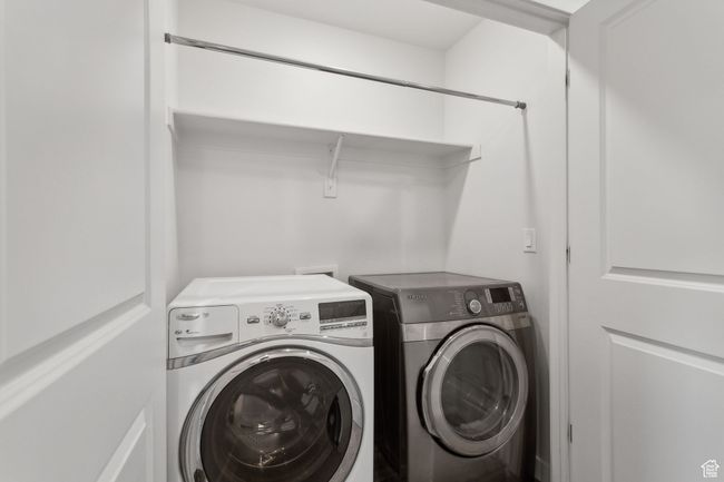 Clothes washing area featuring separate washer and dryer | Image 14