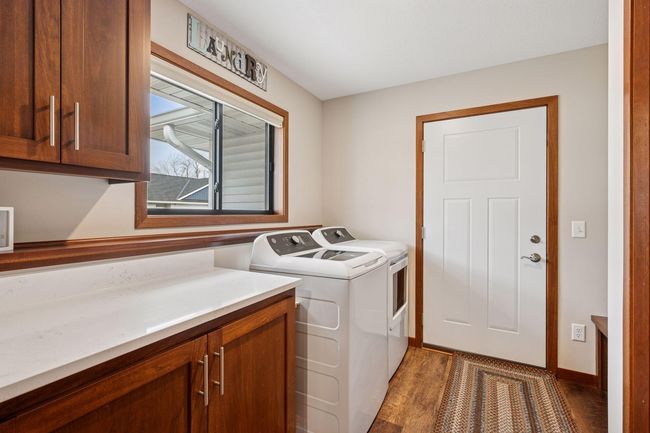 Laundry Room includes cabinetry for organization and a Boot Bench | Image 23