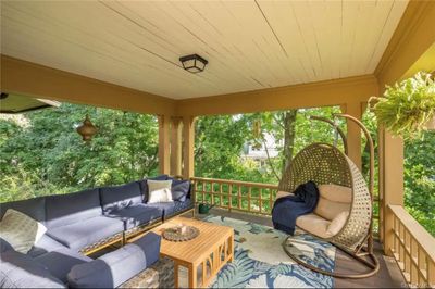 Gracious wrap around porch with spacious seating area. | Image 3