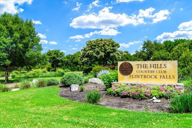 Community sign featuring a lawn and view of scattered trees | Image 38
