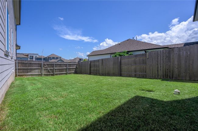 View of fenced backyard | Image 22